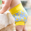 baby stood up wearing a lemon happy nappy swim diaper