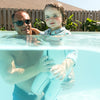 little boy swimming with dad wearing the splash about shorty wetsuit playful otters